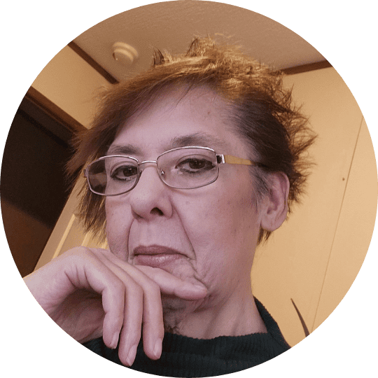 Pensive woman with glasses looking thoughtfully at the AppLuxe℠ app marketplace.
